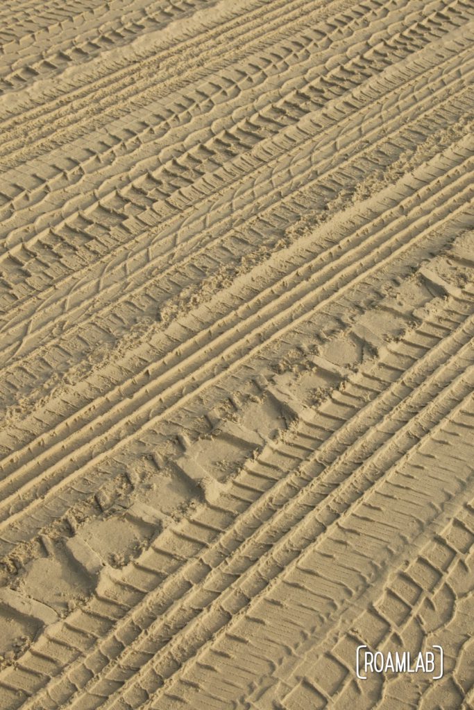 Closeup of tire tracks in the sand at South Beach Padre Island National Seashore, Texas.