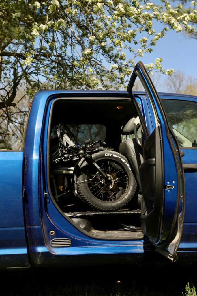 Folding bike stored in a truck cab.