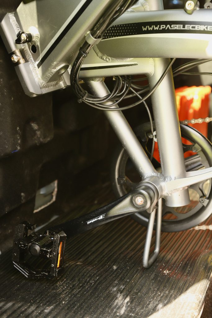 Bike sitting on weather proofed floor of a truck cab.