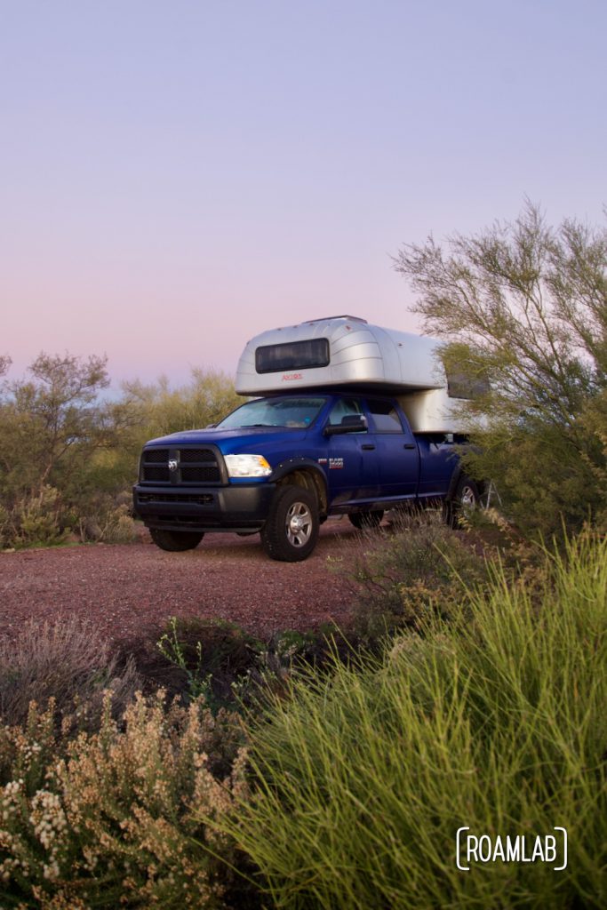 1970 Avion C11 truck camper parked among desert shrubbery at Cholla Campground.