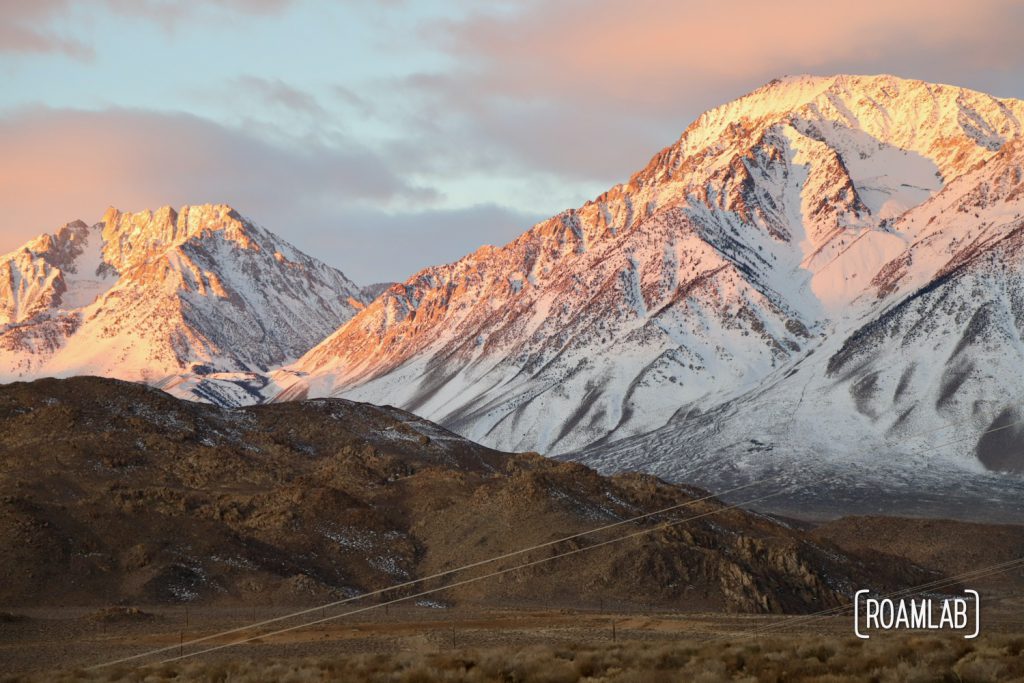 Sunrise view of the snow capped Sierra Nevada from Pleasant Valley Pit near Bishop, California.