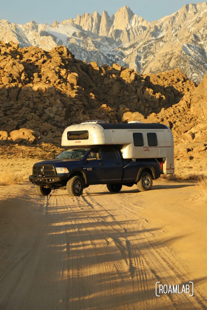 1970 Avion C11 Truck Camper on a blue Ram truck in the Alabama Hills with Mount Whitney in the background among the Sierra Nevada.