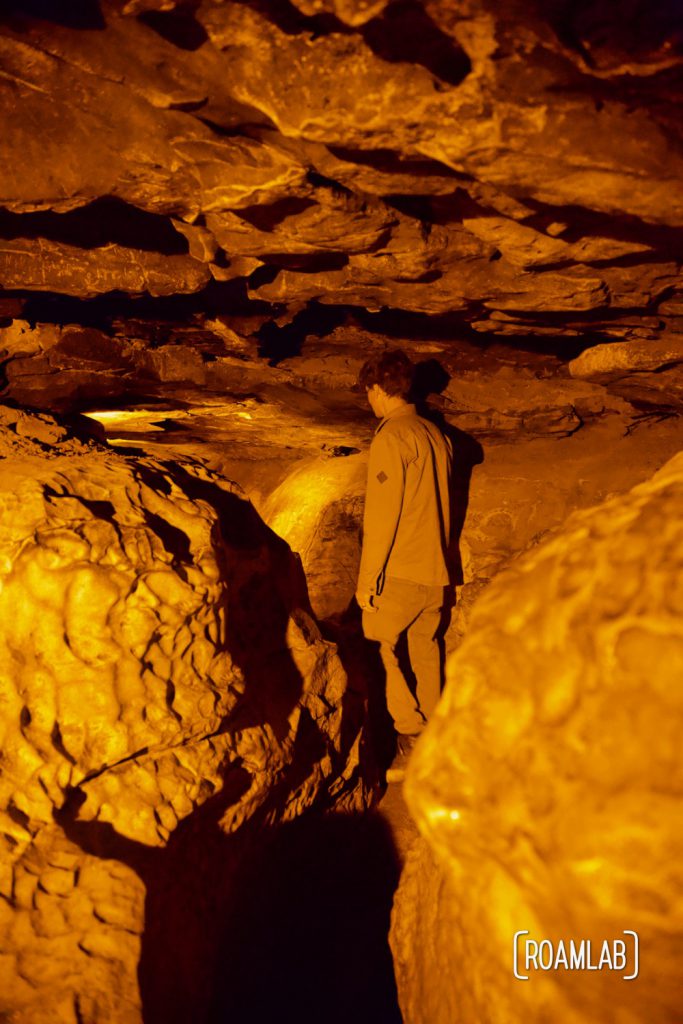 Man spelunking through Fat Man's Misery on the Geology Tour of Mammoth Cave National Park.