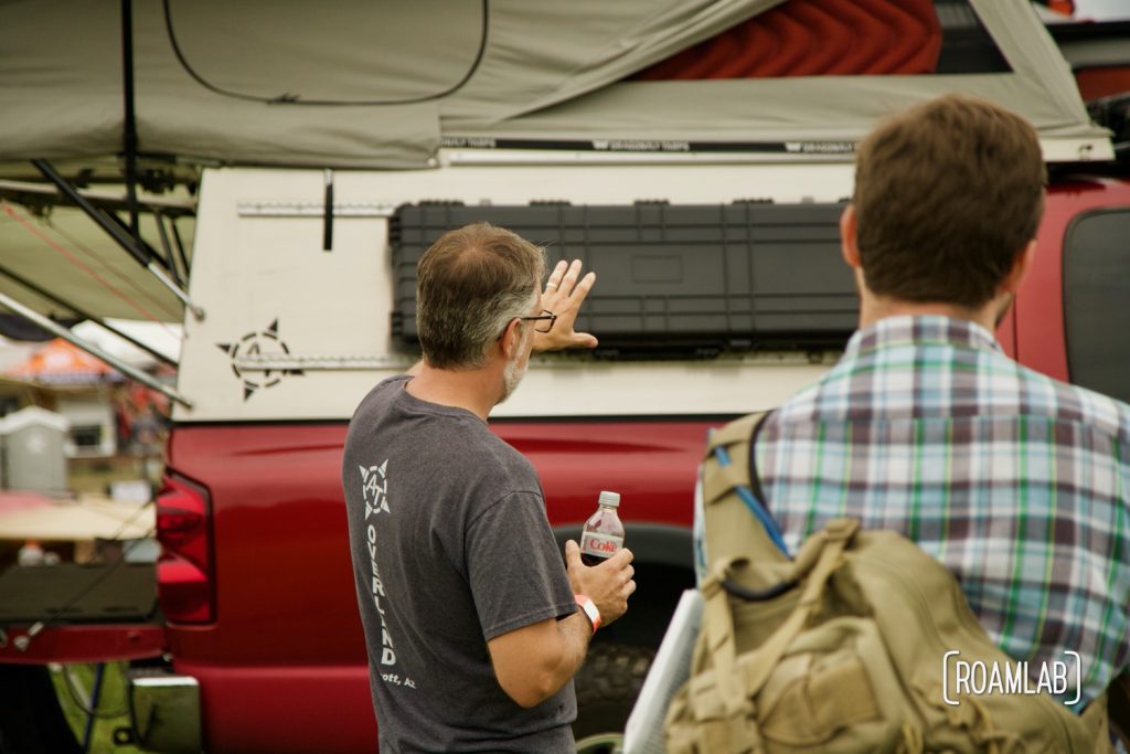 Man presenting his overland rig to a group at Overland Expo East 2021 in Arrington, Virginia.