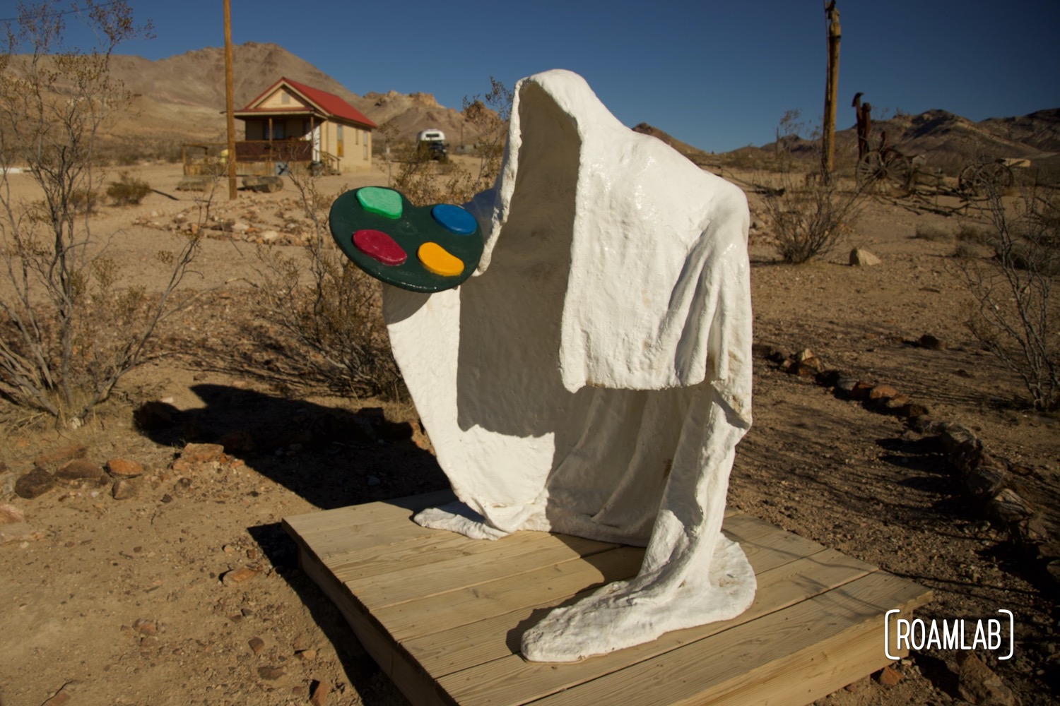 Sculpture of a ghost holding an artist's palette at a Goldwell Open Air Museum.