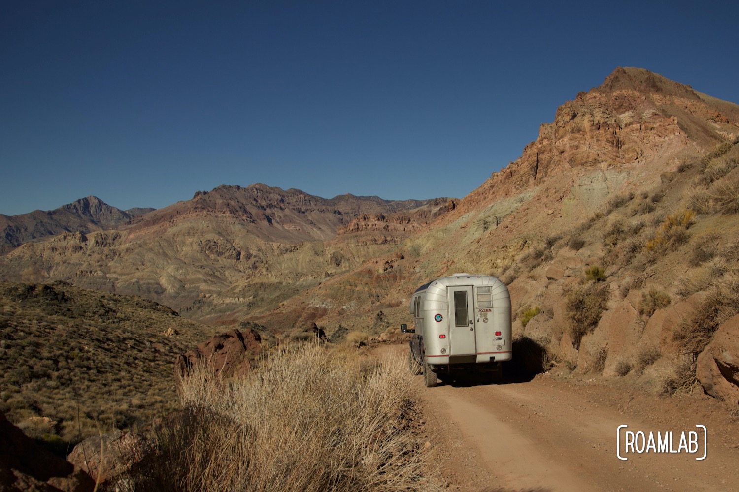 Looking down into the floor of Titus Canyon from a 1970 Avion C11 truck camper following the dirt Titus Canyon Road in Death Valley National Park, California.