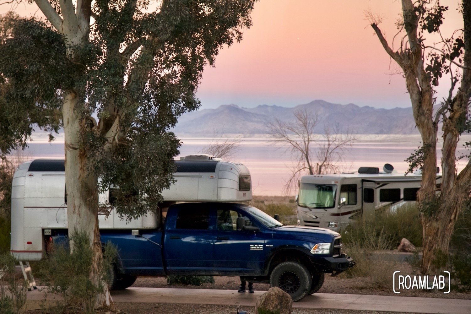 1970 Avion C11 truck camper at sunset in Boulder Beach Campground, Lake Mead National Recreation Area, Nevada.