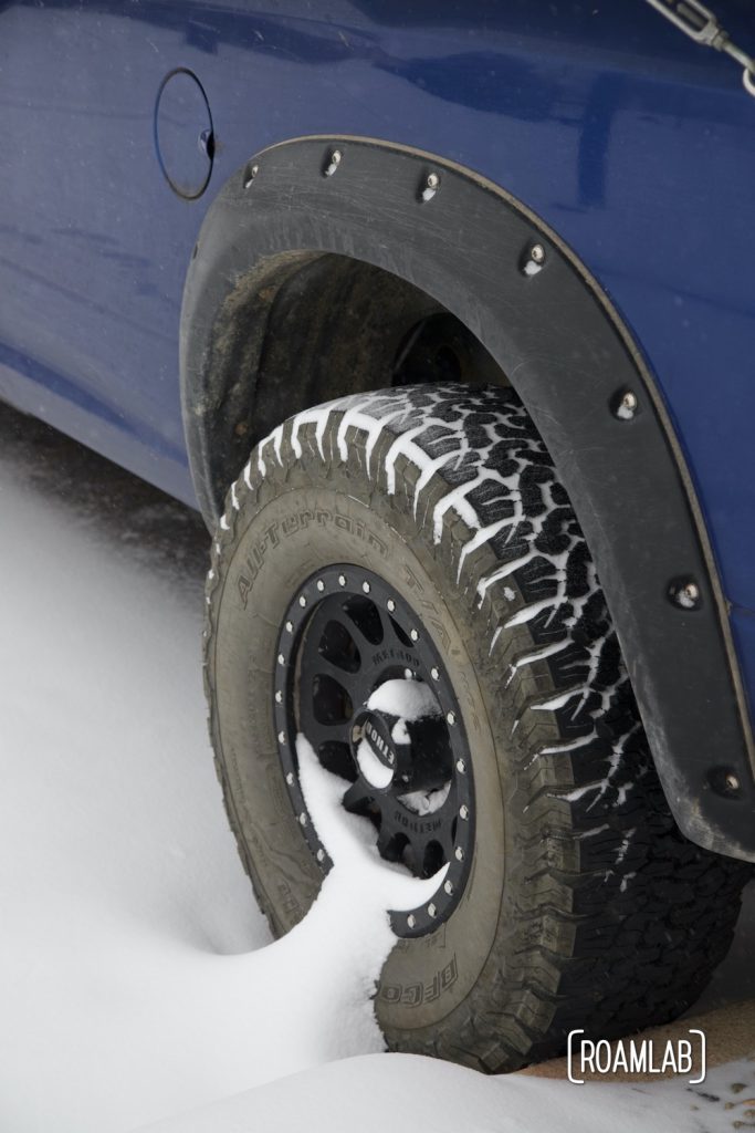Snow collecting in the wheels and tire treads .