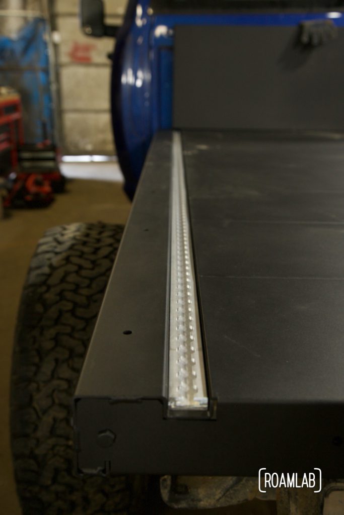 Recessed modular rail for tie downs on a Bowen Customs aluminum truck bed.