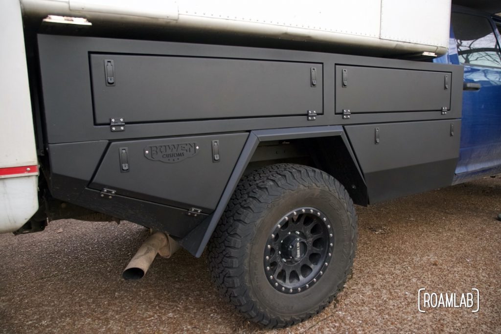 Passenger side view of a Bowen Customs truck bed with a camper installed.