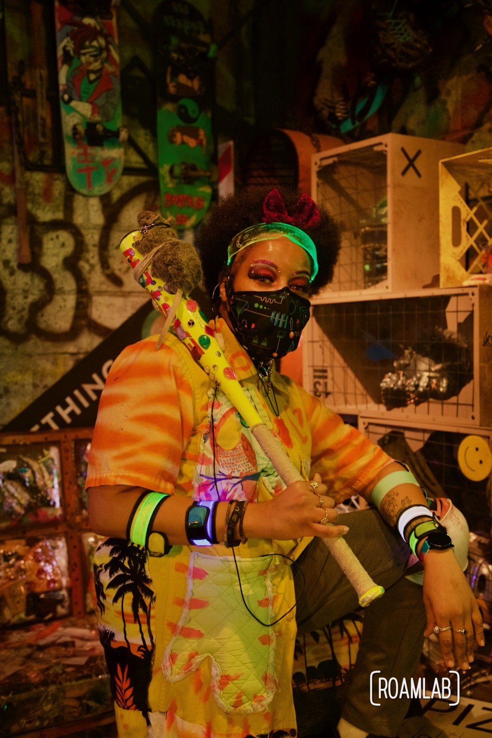 Woman dressed in neon cyberpunk inspired gear, one of the many Convergence Station "locals" here to lend a hand to visitors of the Meow Wolf Denver, Colorado location.
