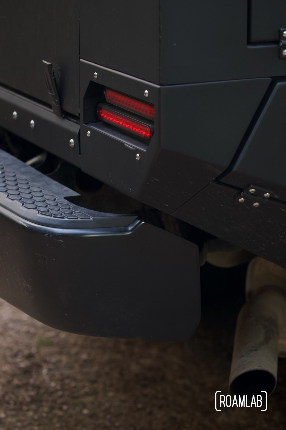 Side view of a truck bumper mounted on to a custom truck bed.