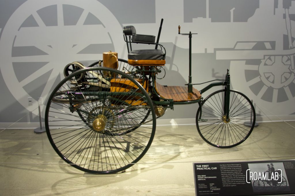 Side view of a 1886 Benz Patent Motorwagen on display at the Petersen Automotive Museum.