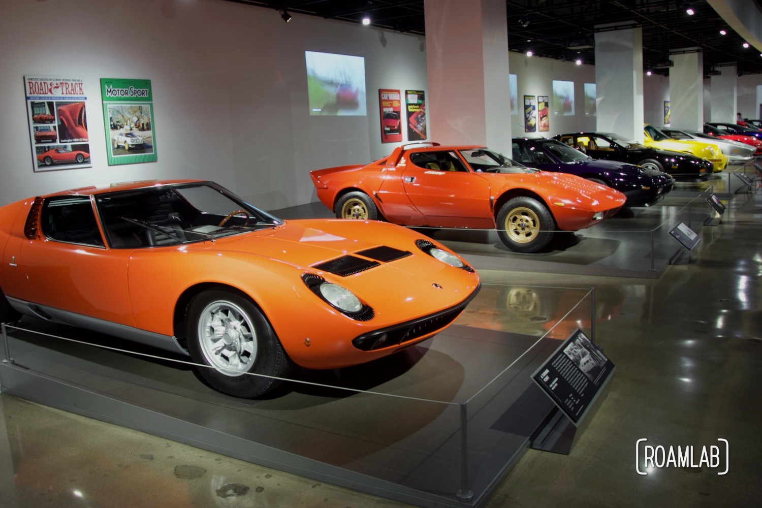 Line of colorful sportscars in the Hypercars exhibit.