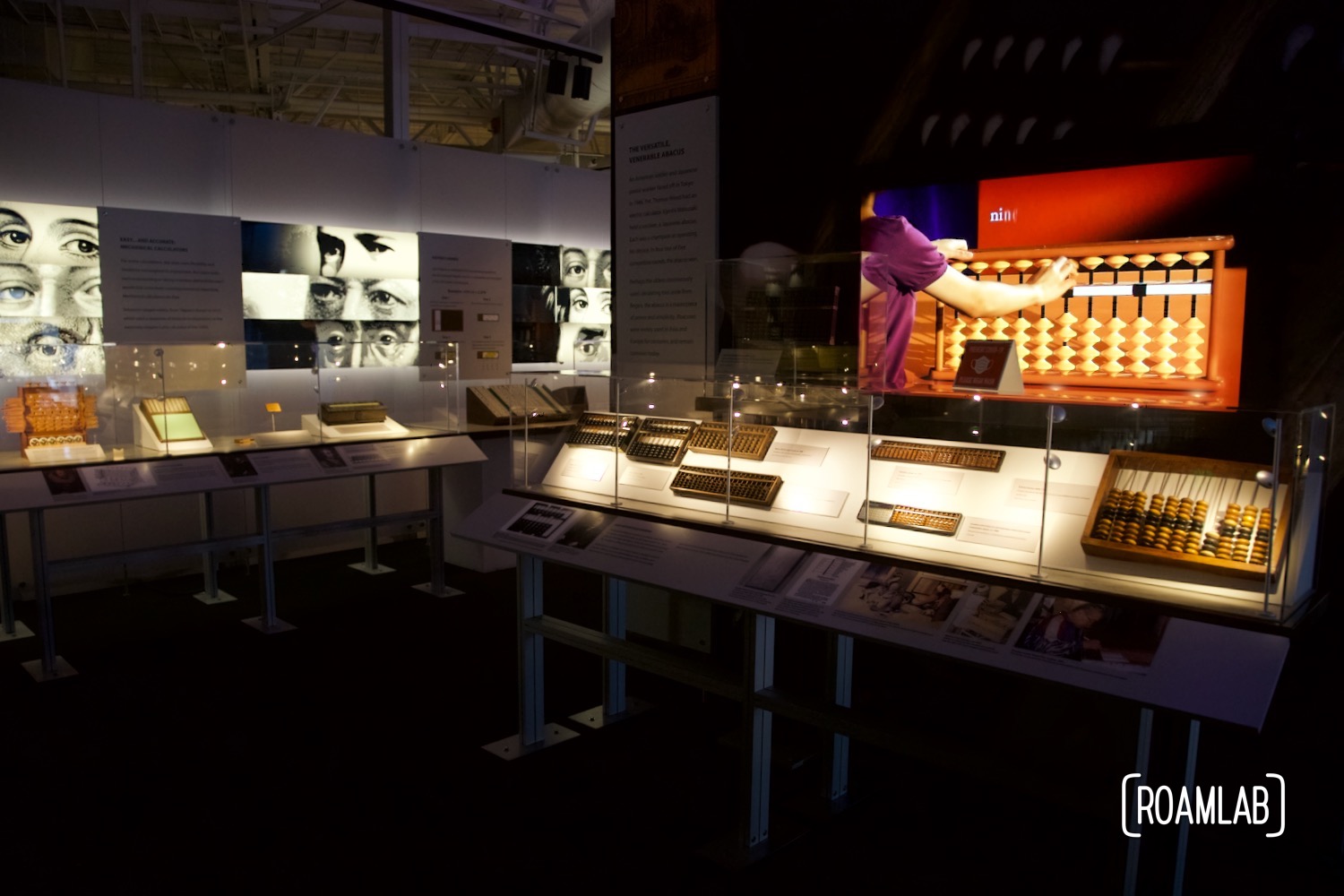 Gallery of historic abacus and other computing tools on display.