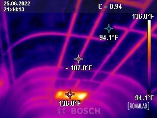 Thermal image of a truck camper roof revealing structural ribs transferring exterior heat into the camper interior.