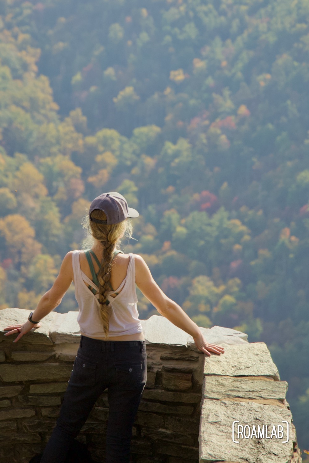 Woman looking out at the mountains of Linville Gorge Wilderness Area from Wiseman's Vista.