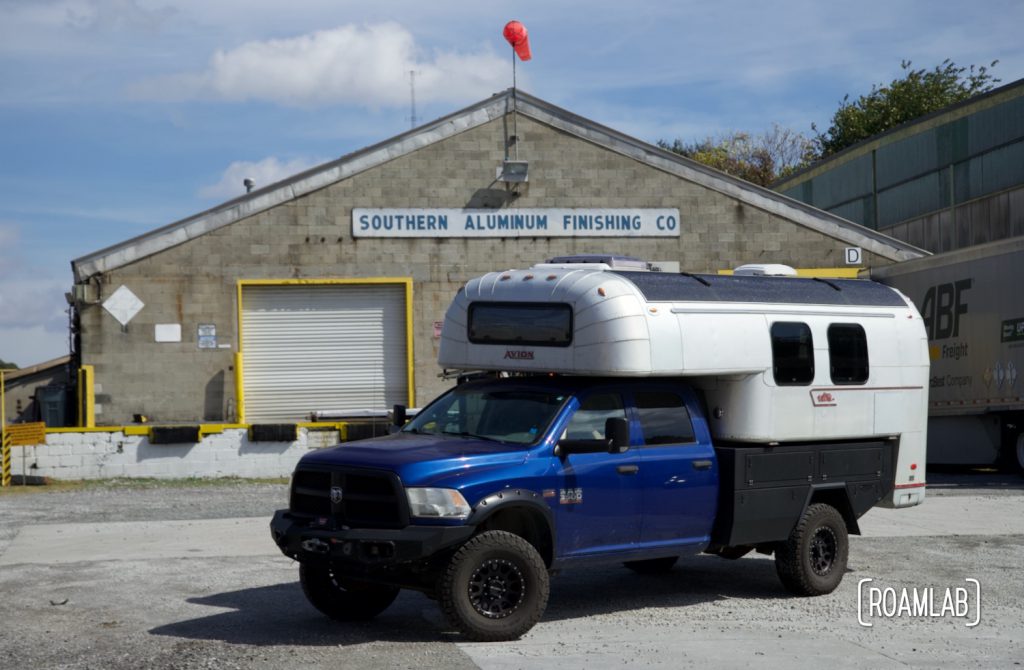 1970 Avion C11 truck camper parked outside the Southern Aluminum Finishing Co warehouse.