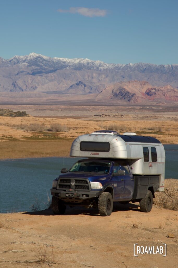 Avion C11 truck camper parked along a cliff by Lake Mead, Nevada.